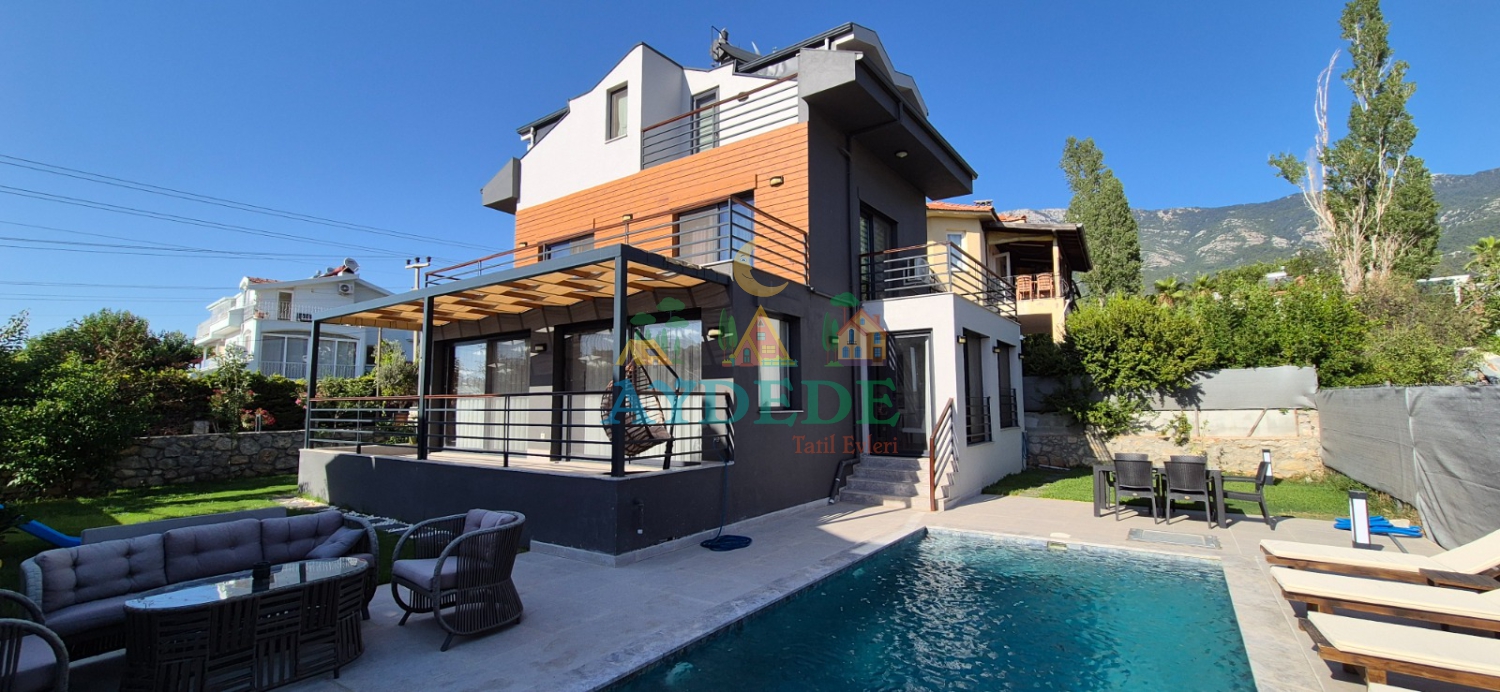 Villa Twins 23 Fethiye Ovacık’ta özel yüzme havuzu, modern mimarisi ve geniş dış yaşam alanıyla konforlu villa tatili sunuyor.